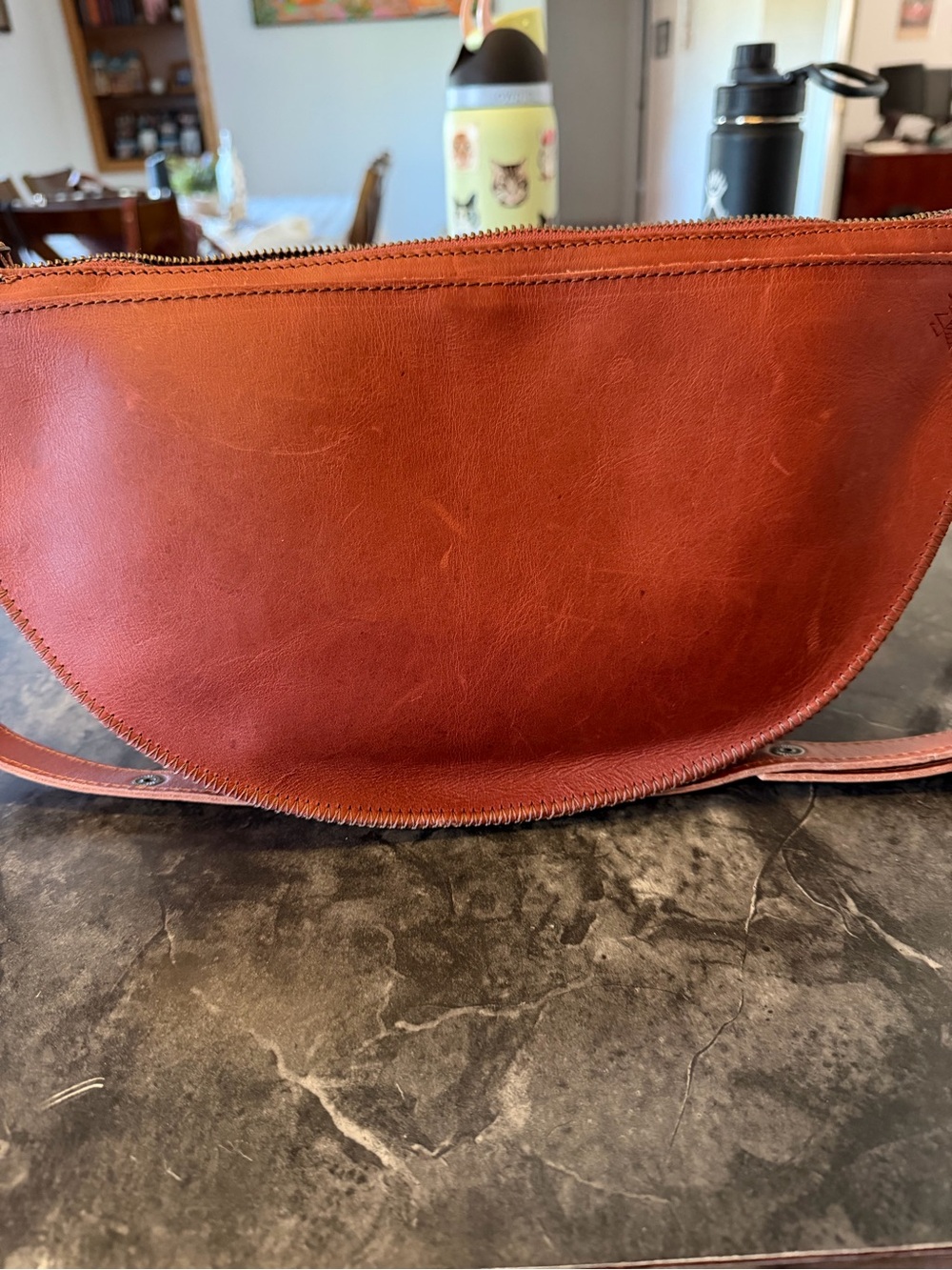 Lying Leather Half-Moon Crossbody Bag in Cognac Brown Queen Bee